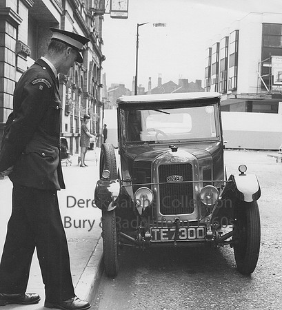 Bolton, Mealhouse Lane, Traffic Warden and old Singer car