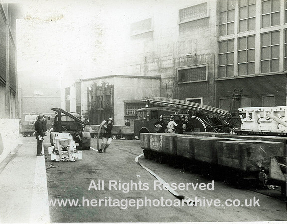 HRS 2059 Fireman unfurls hose in pit yard
