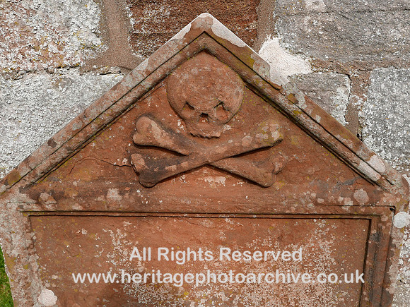 HRS 10462 Bolton village, Church of All Saints, carving of skull and cross-bones L7750026