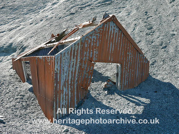 HRS 10250 Honister slate mine, tin hut partly buried in slate waste L7740758