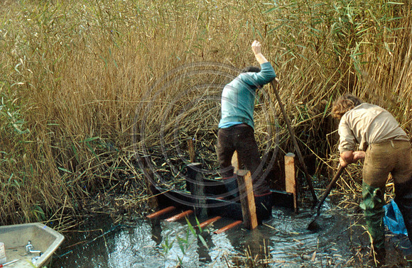 Ditch clearing 2 men