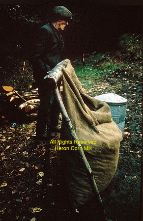 Man and charcoal sack